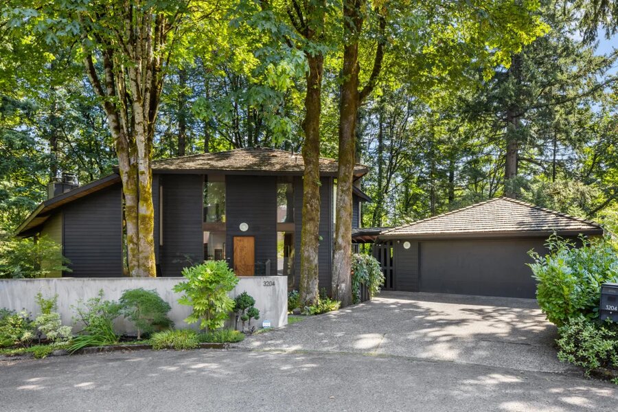 The Arlington Heights house and its cantilevered deck in the trees.